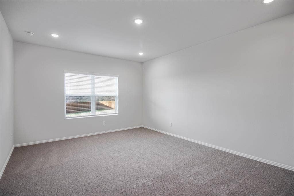 3517 Foxhound Lane, Denton, TX 76208 Recessed lighting illuminates neutral walls and gray carpeting