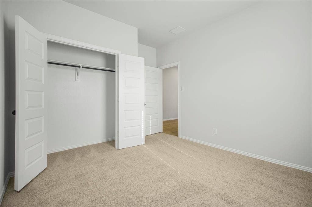 3517 Foxhound Lane, Denton, TX 76208 Neutral-toned carpet flooring and white walls