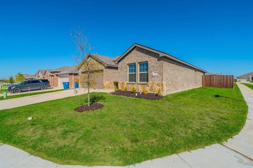 1842 Shady Elm Drive, Lancaster, TX 75146 Brick and stone exterior with architectural detail, complemented by manicured landscaping and mature plantings