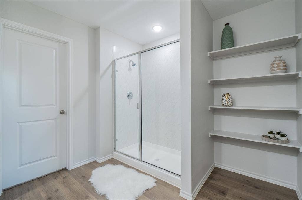1842 Shady Elm Drive, Lancaster, TX 75146 Walk-in shower with clear glass enclosure and chrome fixtures