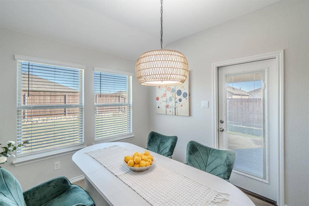 1842 Shady Elm Drive, Lancaster, TX 75146 Bright interior with two windows, a light fixture, and a glass-paneled door