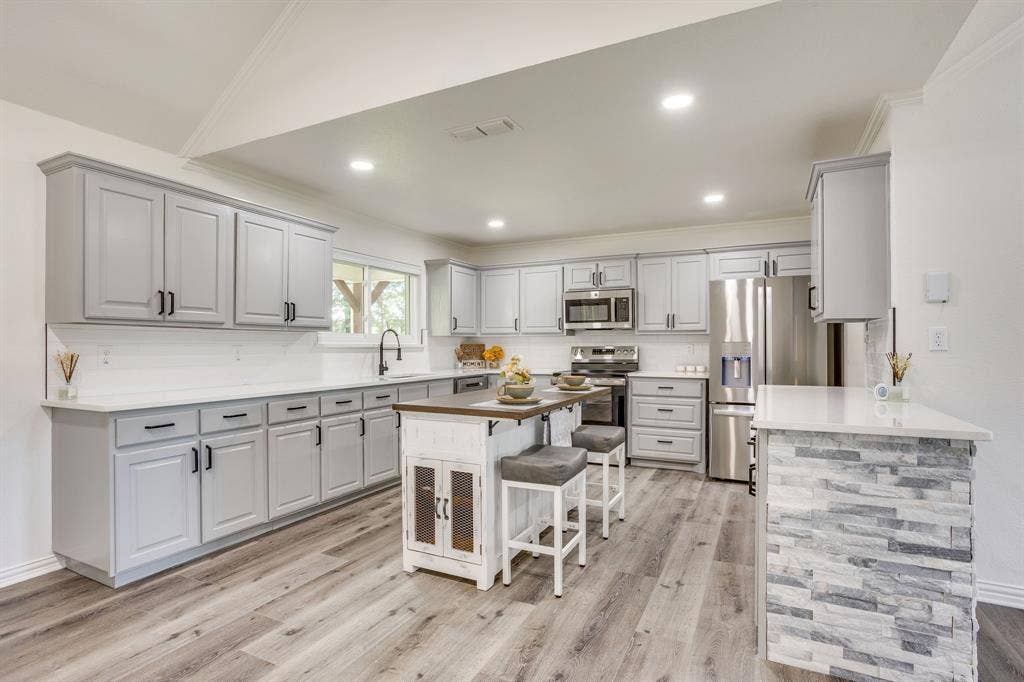 Cabinets galore with a pantry in this home!