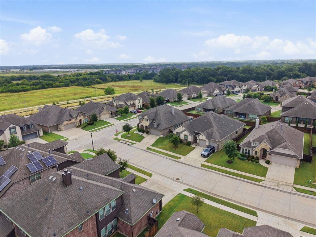 1218 Misty Ridge Drive, Justin, TX 76247 Residential neighborhood featuring mature landscaping, paved streets, and varied architectural styles