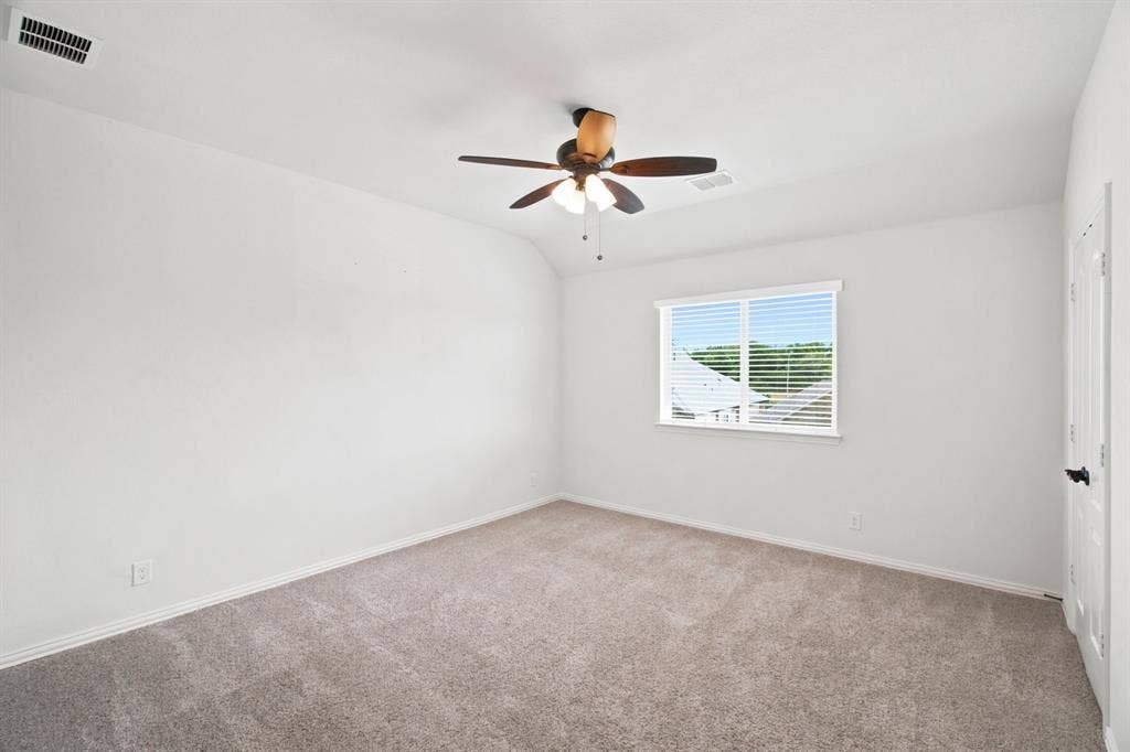 1218 Misty Ridge Drive, Justin, TX 76247 Recessed ceiling with an integrated ceiling fan and light fixture, window with blinds, and neutral carpet flooring