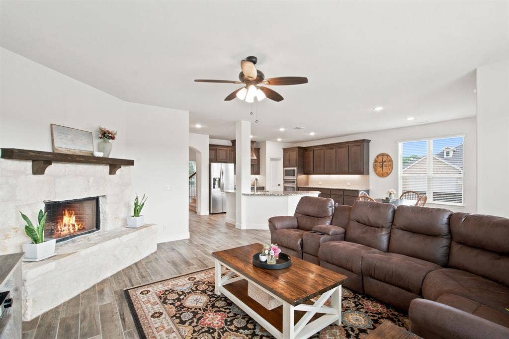 1218 Misty Ridge Drive, Justin, TX 76247 Stone-clad fireplace with wood mantel