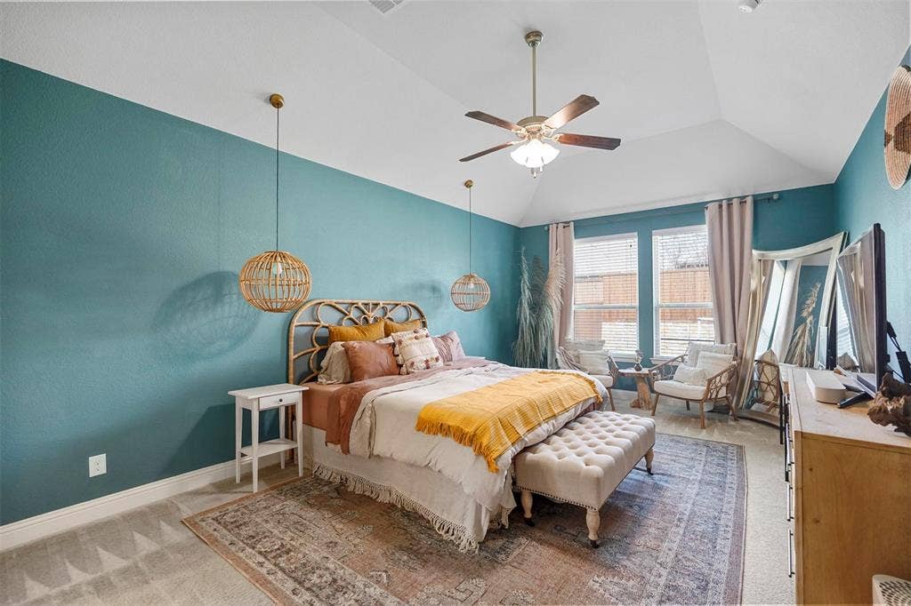 1506 Carnation Street, Celina, TX 75078 Vaulted ceiling with a ceiling fan, dual windows with blinds, and pendant lighting