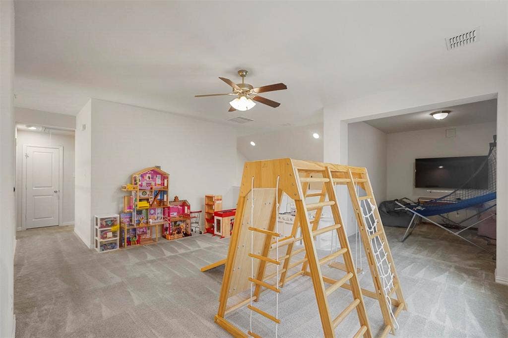 1506 Carnation Street, Celina, TX 75078 Spacious interior with neutral carpeting, recessed lighting, and a ceiling fan