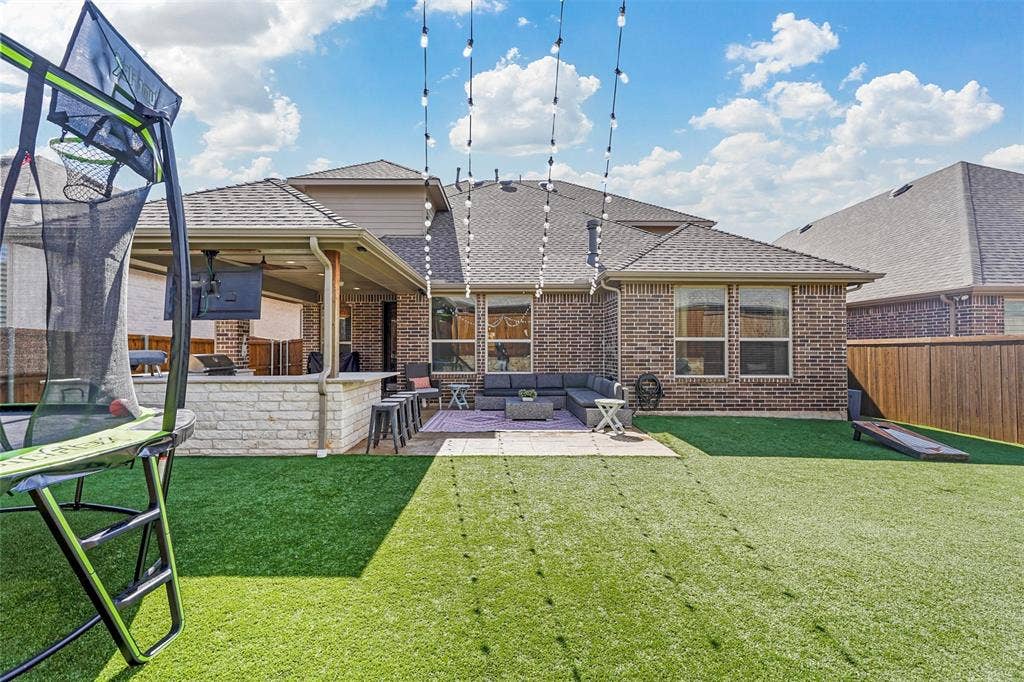 1506 Carnation Street, Celina, TX 75078 Brick exterior with multiple windows