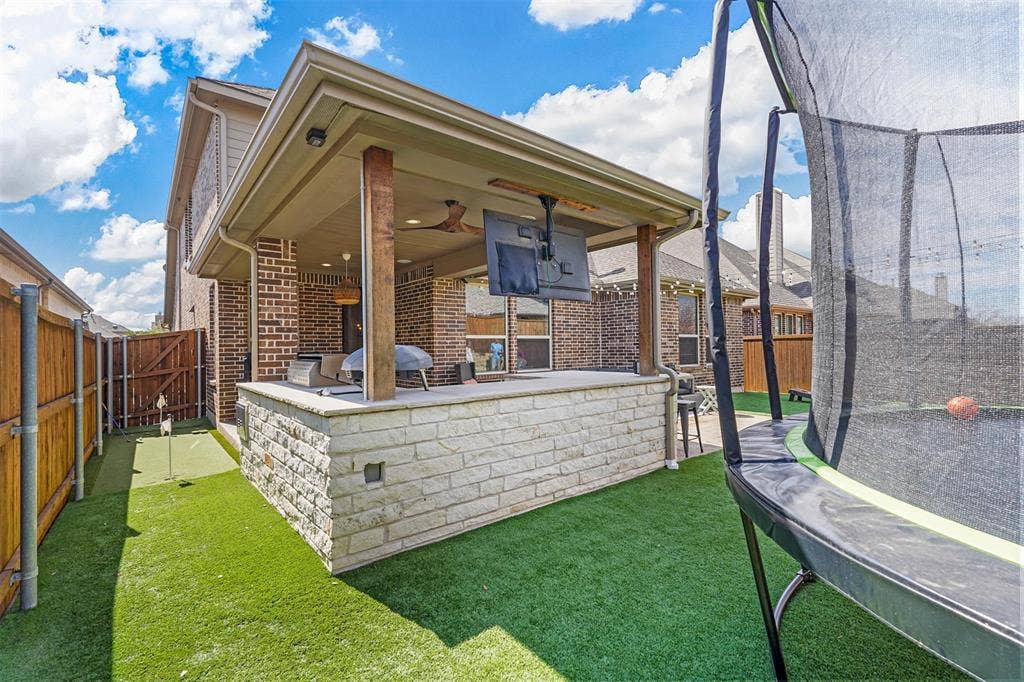 1506 Carnation Street, Celina, TX 75078 Covered patio featuring a ceiling fan, recessed lighting, and a mounted television