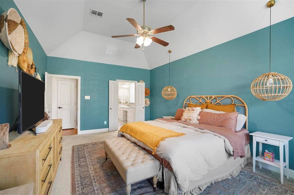 1506 Carnation Street, Celina, TX 75078 Vaulted ceiling with a ceiling fan, dual pendant lighting, and a neutral carpeted floor
