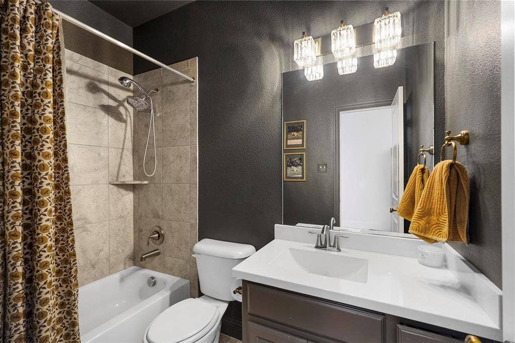 1506 Carnation Street, Celina, TX 75078 Built-in bathtub with tiled surround, showerhead, and wall-mounted faucet