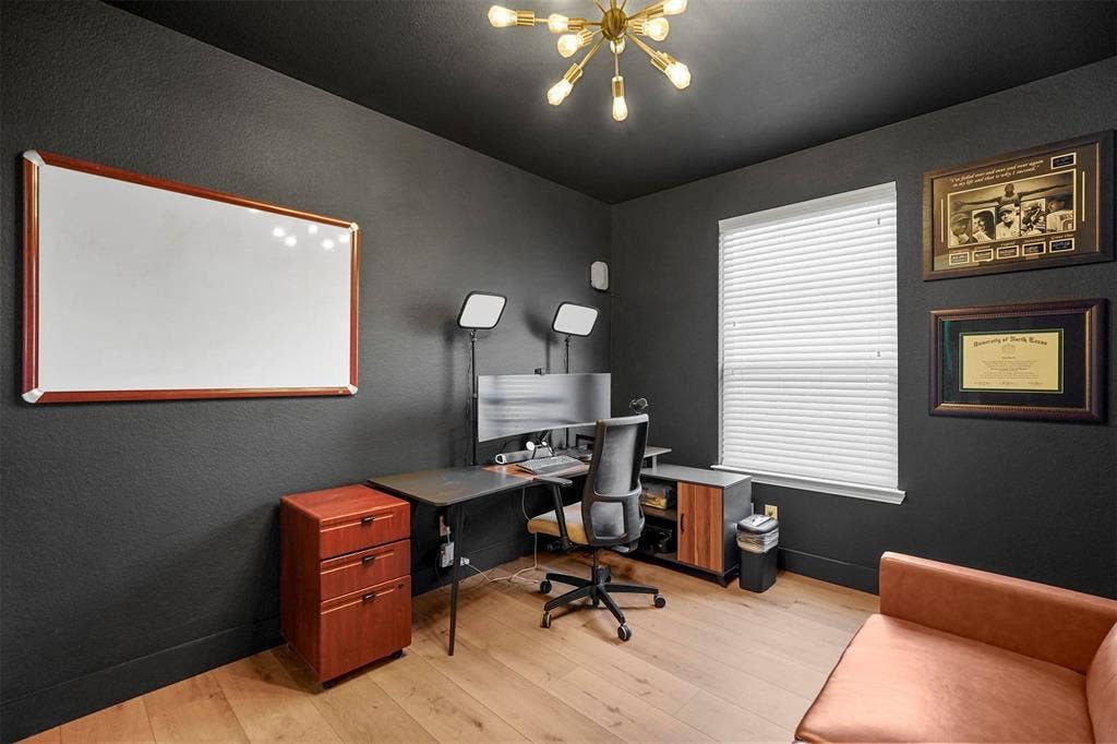 1506 Carnation Street, Celina, TX 75078 Wood-finish flooring, dark wall finishes, and a modern sputnik-style light fixture