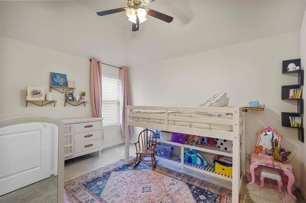 1506 Carnation Street, Celina, TX 75078 Vaulted ceiling with a ceiling fan, white walls, and a window with blinds