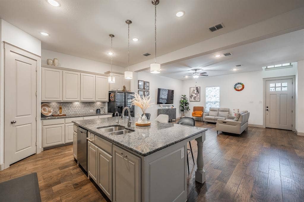 Kitchen opens up to the living room, perfect for entertaining guests