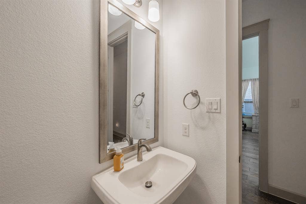 Pedestal sink in the first floor powder room