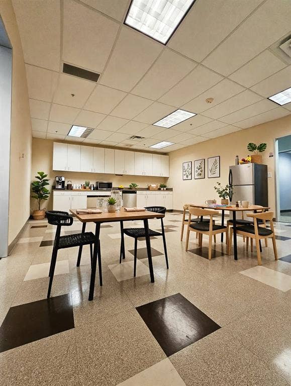 1675 Republic Parkway, #201A, Mesquite, TX 75150 Kitchenette featuring white cabinetry, a stainless steel refrigerator, and a built-in microwave