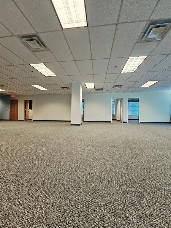 1675 Republic Parkway, #201A, Mesquite, TX 75150 Expansive open-plan interior featuring neutral-toned carpeting and a grid ceiling with recessed lighting