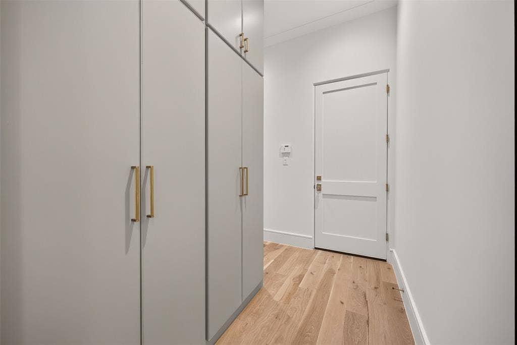 White two-panel interior door with brass hardware