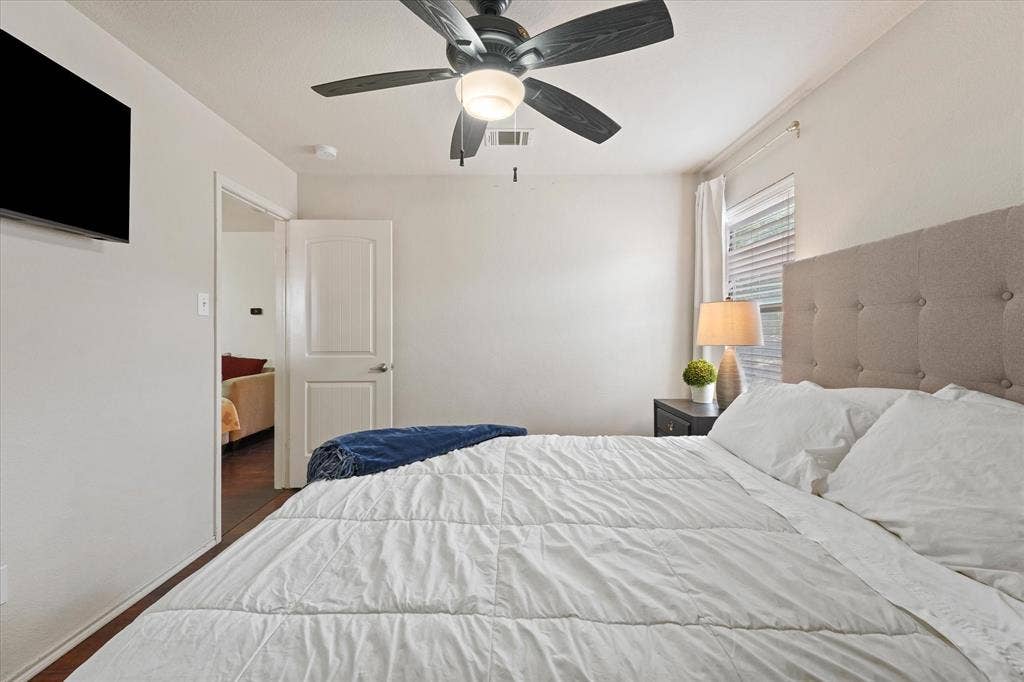 2053 Lake Trail Drive, Heartland, TX 75126 Recessed lighting, ceiling fan with integrated light, wood-finish flooring, white paneled door, and window with blinds