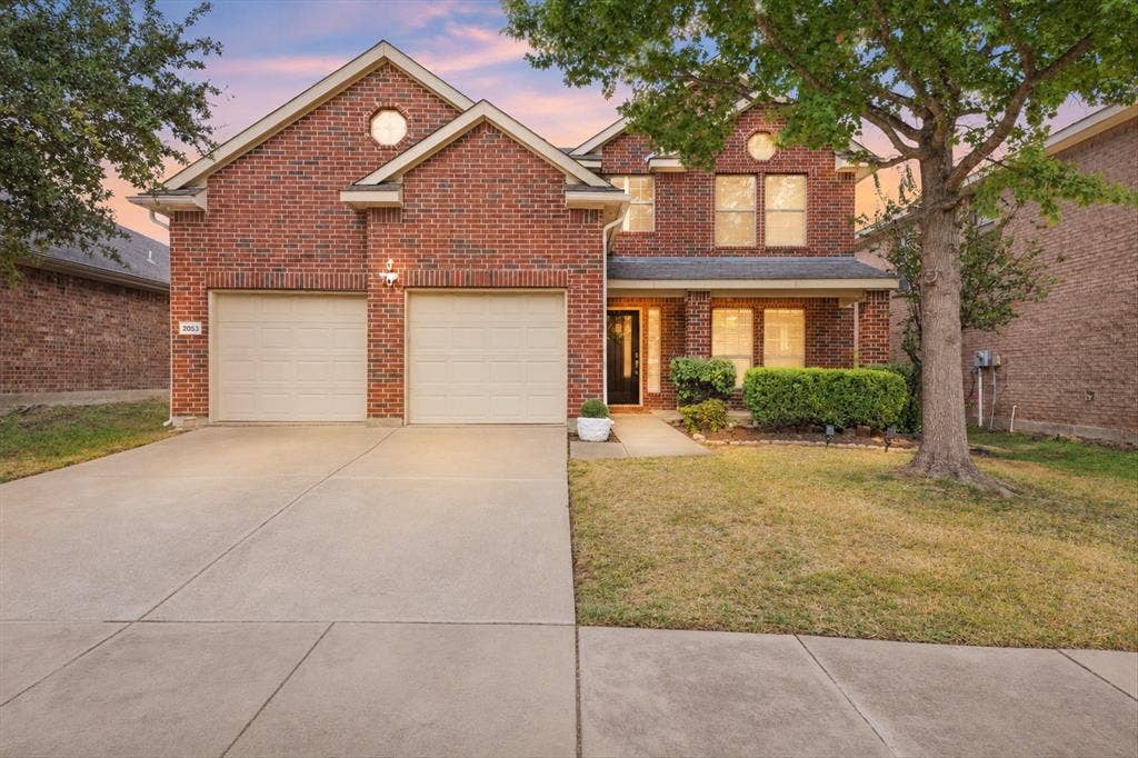 2053 Lake Trail Drive, Heartland, TX 75126 Brick exterior with gabled roof lines and round accent window