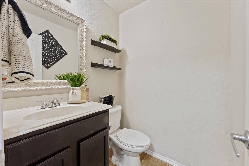 2053 Lake Trail Drive, Heartland, TX 75126 Built-in vanity with a single basin sink and dual-handle faucet