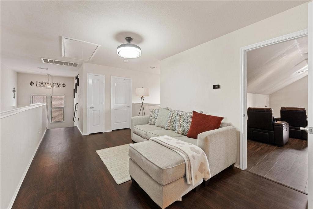 2053 Lake Trail Drive, Heartland, TX 75126 Wood-finish flooring throughout, white interior doors with contemporary hardware, and a semi-flush mount ceiling light fixture