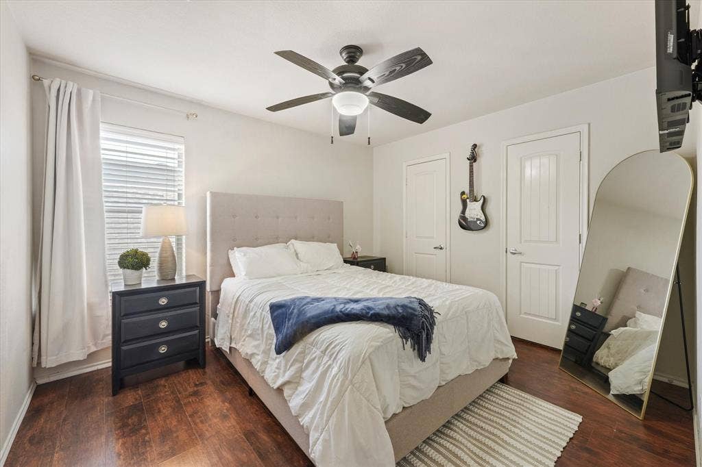 2053 Lake Trail Drive, Heartland, TX 75126 Wood-finish flooring with white walls and a ceiling fan with integrated lighting