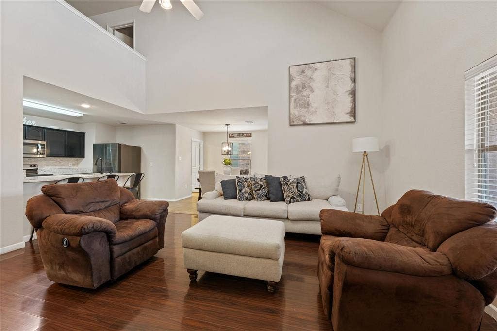 2053 Lake Trail Drive, Heartland, TX 75126 Vaulted ceiling, ceiling fan, wood-finish flooring, kitchen pass-through, and window with blinds