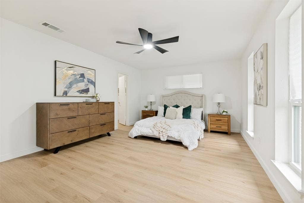 5311 Banting Way, Dallas, TX 75227 Large primary bedroom with walk in closet and natural light from front windows