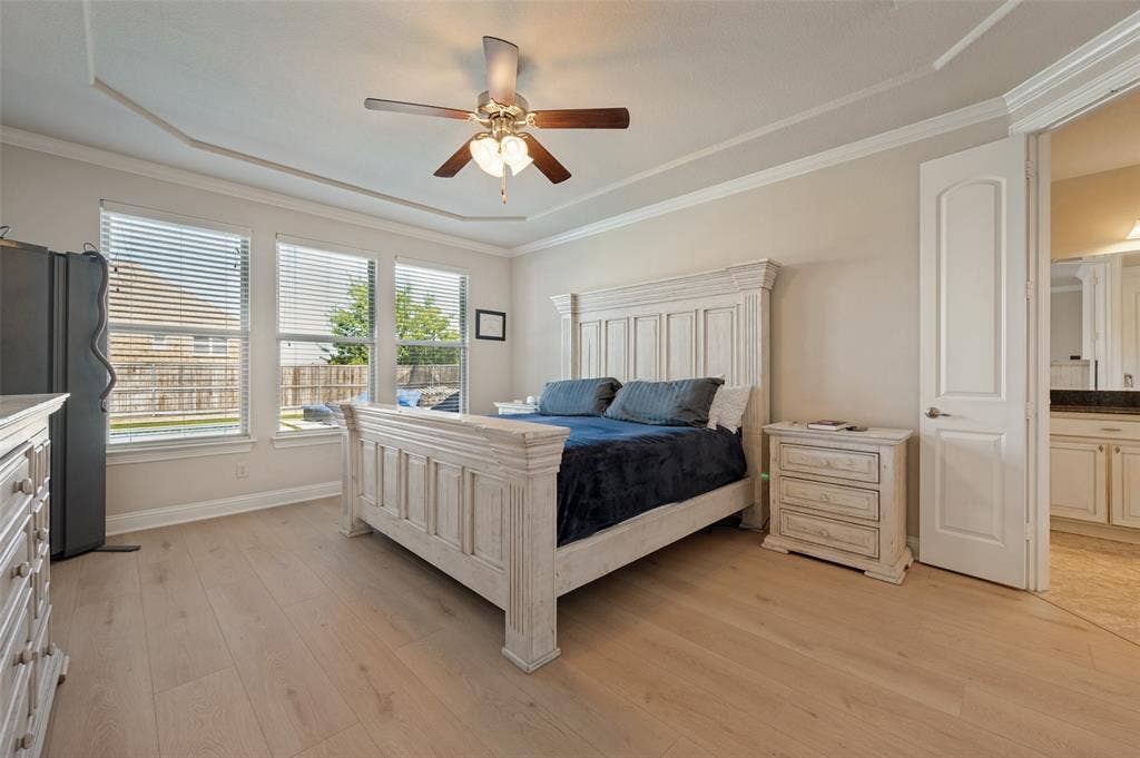 741 Darian Drive, Prosper, TX 75078 Tray ceiling, crown molding, wood-finish flooring, ceiling fan with light fixture, three large windows