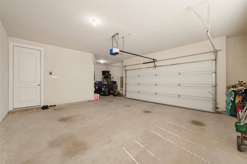 741 Darian Drive, Prosper, TX 75078 Attached garage with concrete flooring, automatic garage door opener, and a panel door