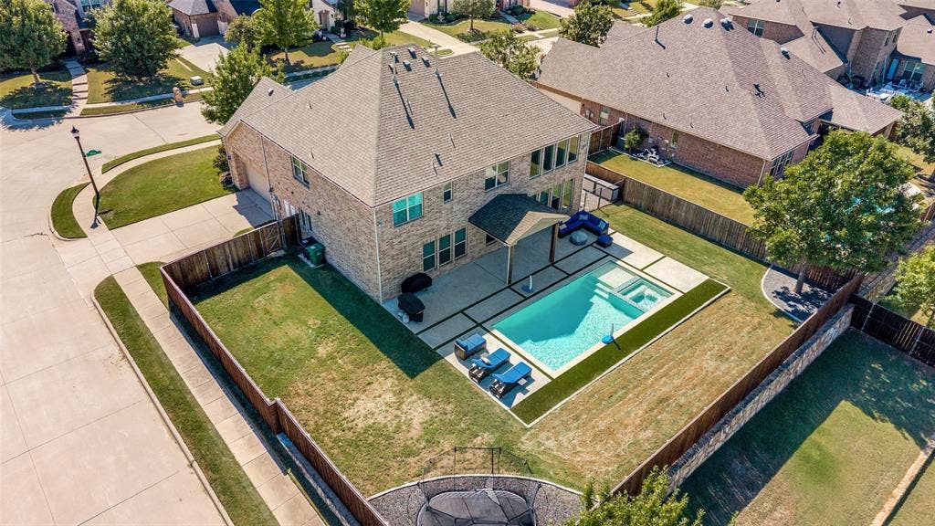 741 Darian Drive, Prosper, TX 75078 Brick exterior, fenced backyard, in-ground swimming pool, concrete patio, mature tree