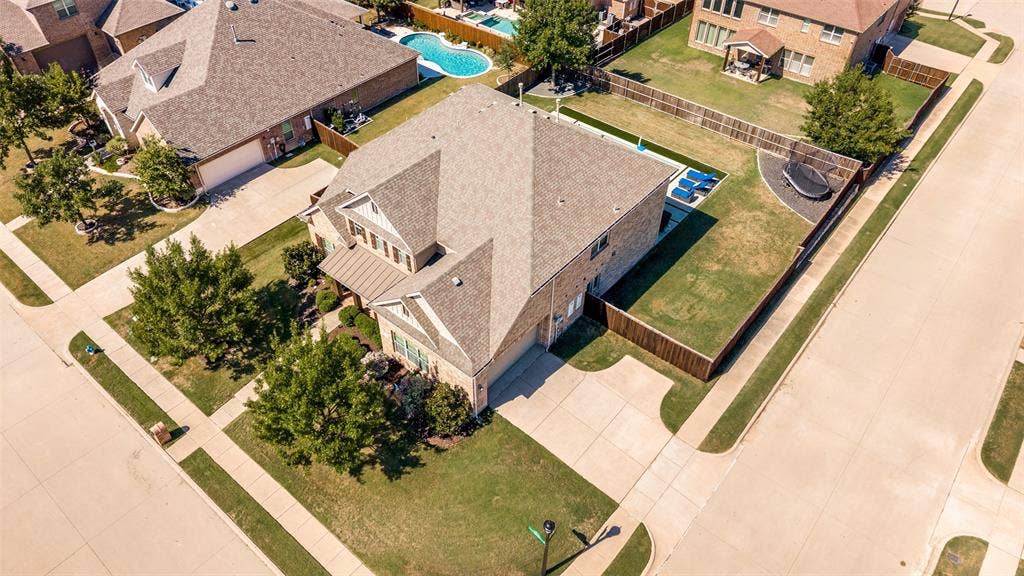 741 Darian Drive, Prosper, TX 75078 Brick exterior, pitched roof, attached garage, concrete driveway, fenced yard