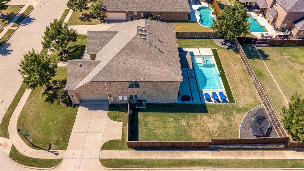 741 Darian Drive, Prosper, TX 75078 Brick exterior residence with an asphalt shingle roof