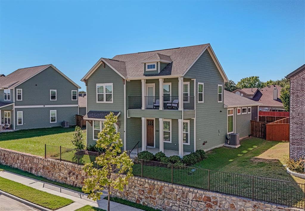 2601 Lafayette Drive, Rowlett, TX 75088 Two-story residence with a recessed balcony, covered entry, and dormer window