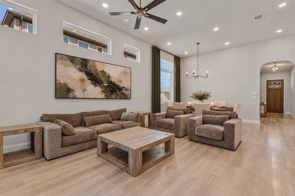 2601 Lafayette Drive, Rowlett, TX 75088 Spacious open-concept living area featuring high ceilings, recessed lighting, and wood-finish flooring
