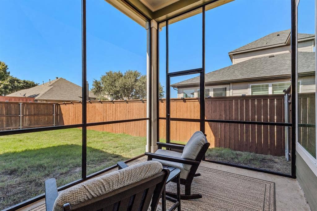 2601 Lafayette Drive, Rowlett, TX 75088 Screened patio with a concrete floor and a wood fence