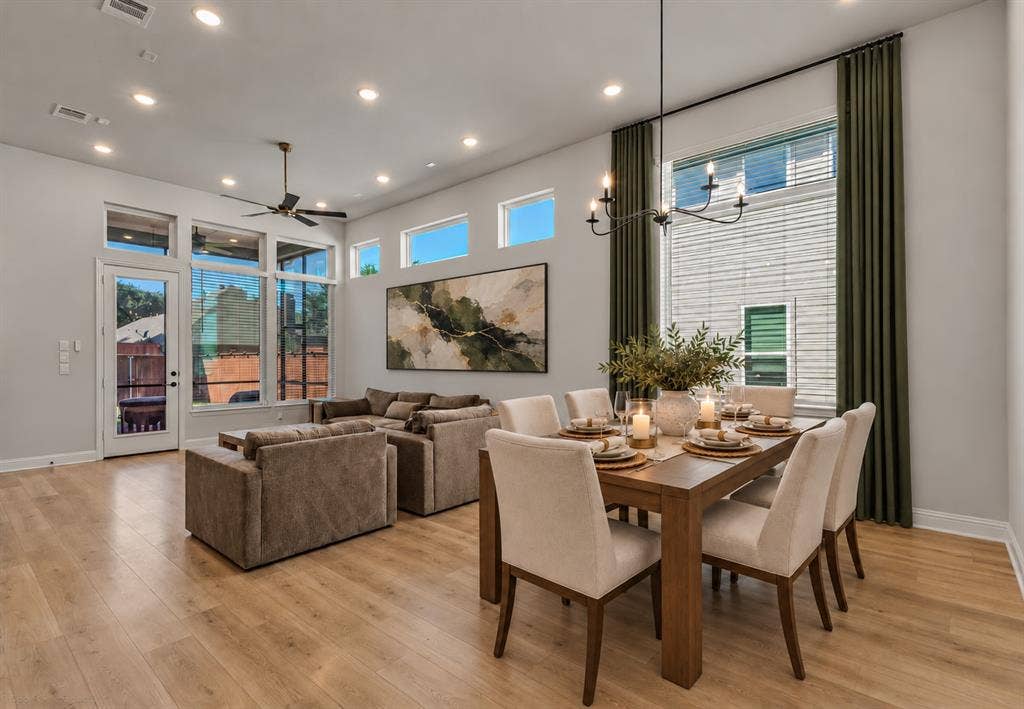 2601 Lafayette Drive, Rowlett, TX 75088 Open-concept living area featuring wood-finish flooring, recessed lighting, and a modern chandelier