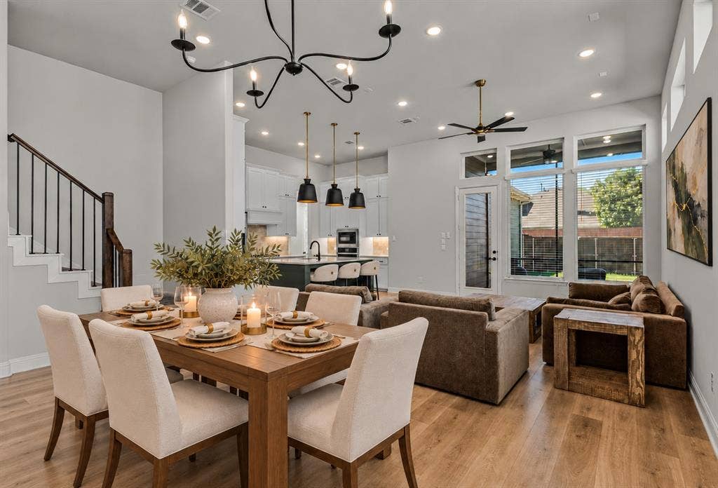 2601 Lafayette Drive, Rowlett, TX 75088 Wood-finish flooring throughout, complemented by a modern chandelier and recessed lighting