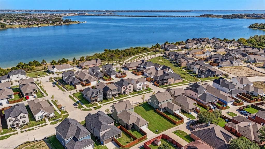 2601 Lafayette Drive, Rowlett, TX 75088 Waterside community featuring a variety of architectural styles, paved streets, and landscaped lots