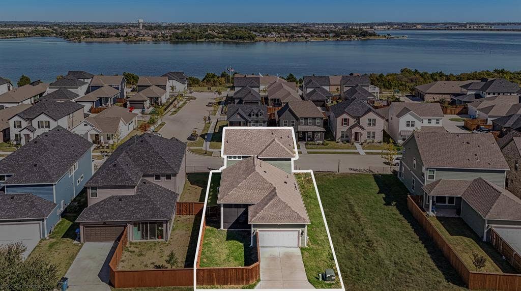 2601 Lafayette Drive, Rowlett, TX 75088 Two-story residence featuring a two-car garage and paved driveway