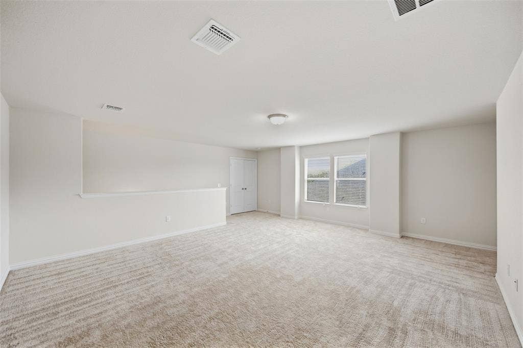1805 Nelson Street, Anna, TX 75409 Expansive carpeted area with neutral wall finishes and natural light from multiple windows