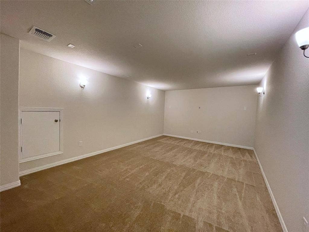 1805 Nelson Street, Anna, TX 75409 Expansive room featuring recessed lighting, wall sconces, neutral-toned carpeting, and a built-in access panel