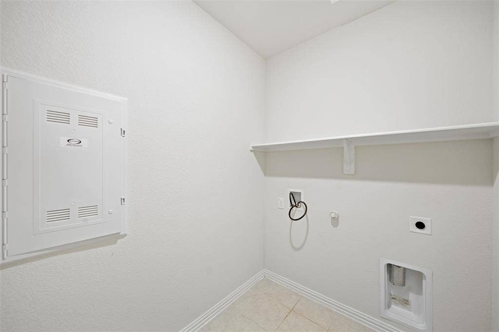 1805 Nelson Street, Anna, TX 75409 Built-in shelving, tile flooring, and utility hookups