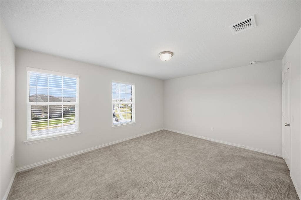 1805 Nelson Street, Anna, TX 75409 Neutral wall finishes, recessed lighting, and carpeted flooring
