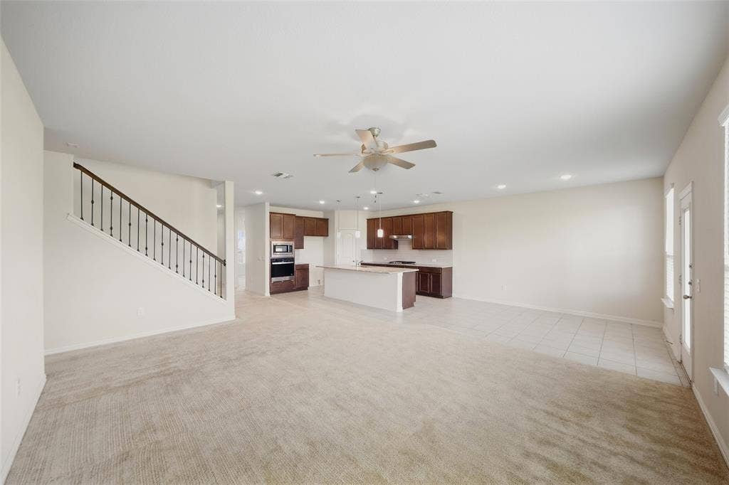 1805 Nelson Street, Anna, TX 75409 Open-concept living area with carpet and tile flooring