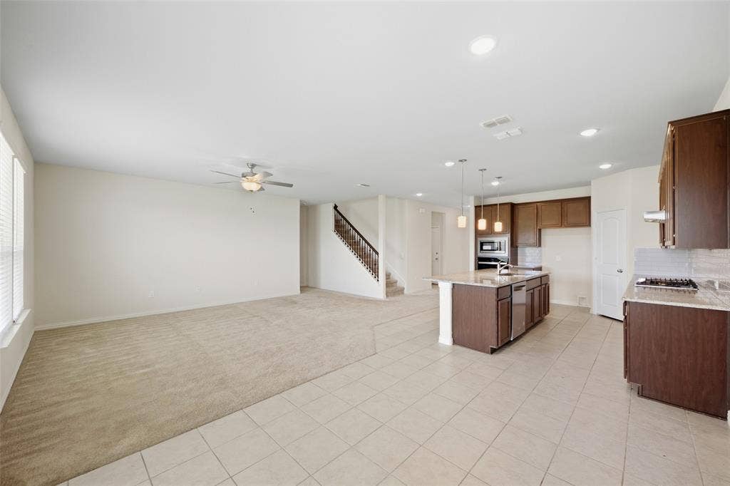 1805 Nelson Street, Anna, TX 75409 Open-concept living area with carpet and tile flooring