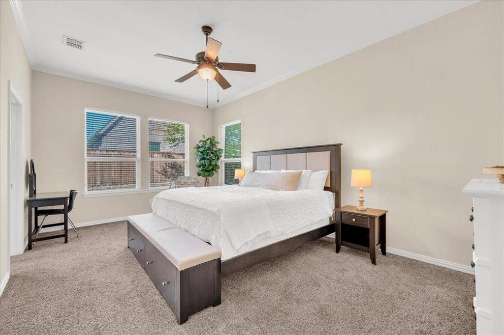 5612 Hampshire Drive, McKinney, TX 75070 Spacious bedroom with vaulted ceiling, ceiling fan, and carpeted flooring