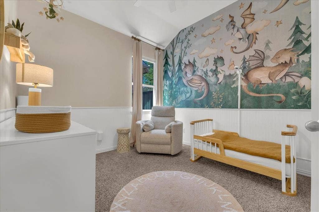 5612 Hampshire Drive, McKinney, TX 75070 Vaulted ceiling, wainscoting, carpeted flooring, window with natural light, and ceiling fan