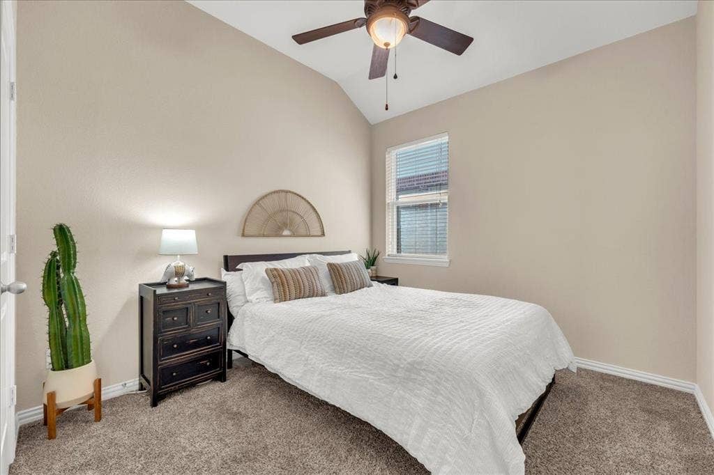 5612 Hampshire Drive, McKinney, TX 75070 Vaulted ceiling, ceiling fan, window with blinds, and carpeted flooring